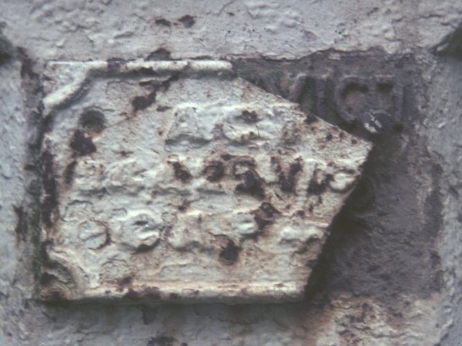 Broken correction plate on Post No 127 showing original inscription underneath in 1965